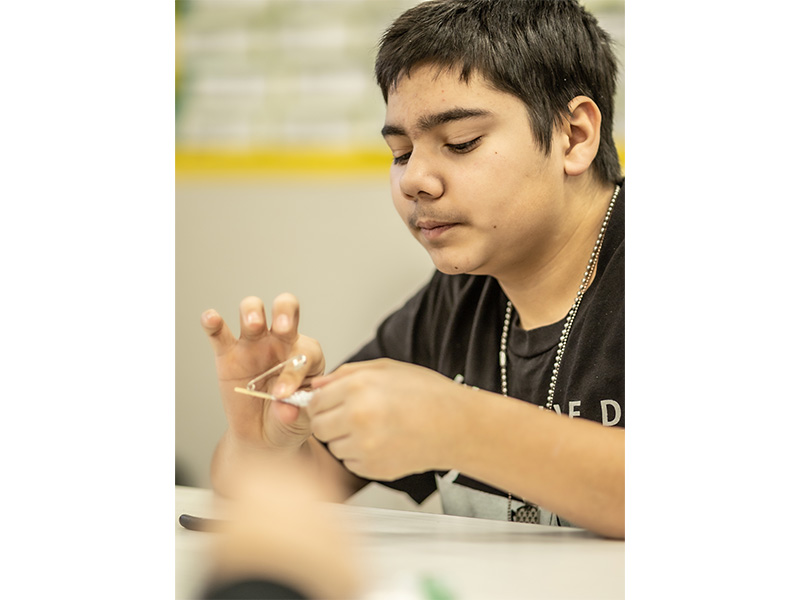 Male student working on a project