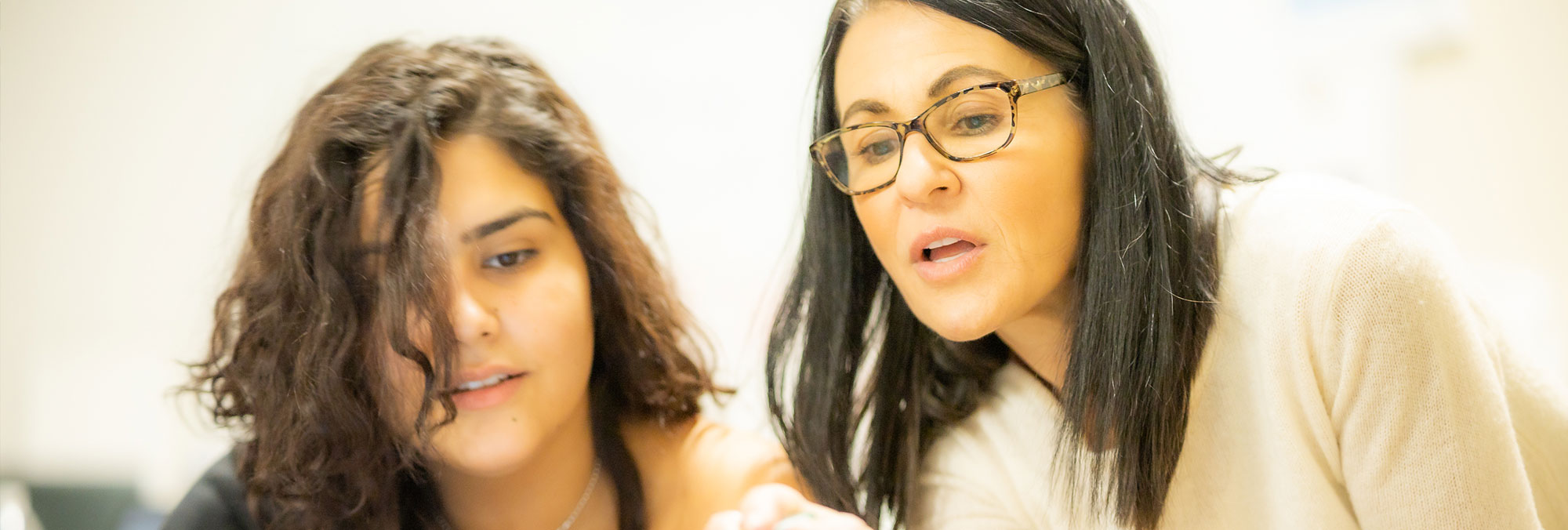 Teacher helping a student