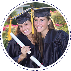 Two girls with diplomas and graduation gowns