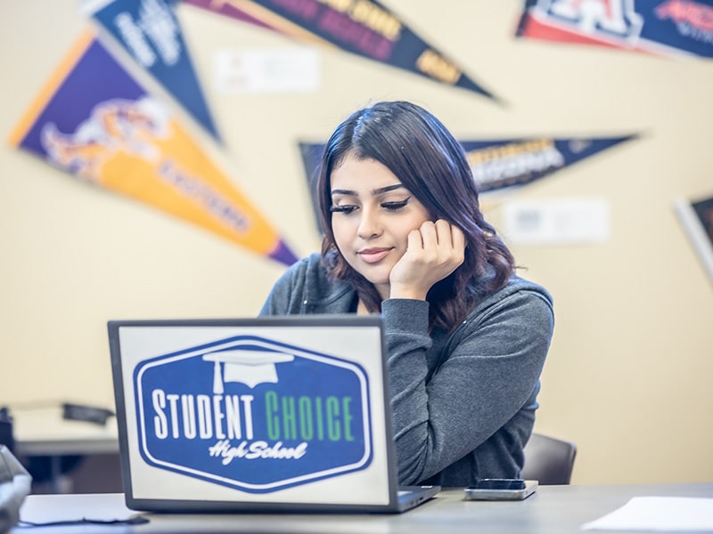 female student working on laptop